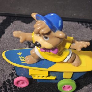Vintage Skateboarding Bear Toy with Colorful Wheels - product image 1